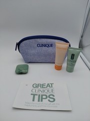 Clinique Zip Pouch w/ Sample Sizes Of Body Scrubber, 7 Day Scrub Cream, & Powder