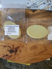 Homemade Fresh Organic Calendula Lotion bars made of beeswax, Shea, cocoa butter