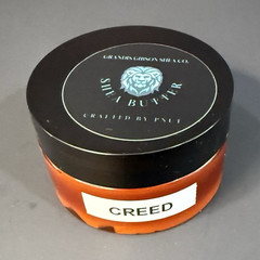 Homemade whipped shea butter scented with creed oil